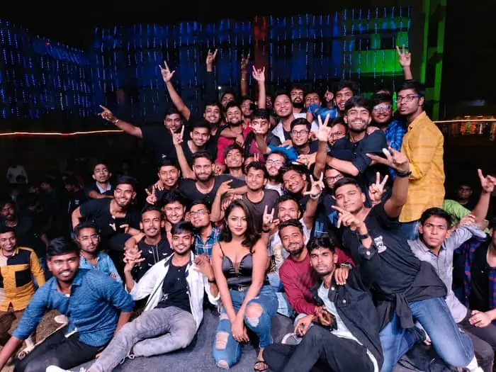 Crowd celebrating with DJ Dazzling at a nightclub